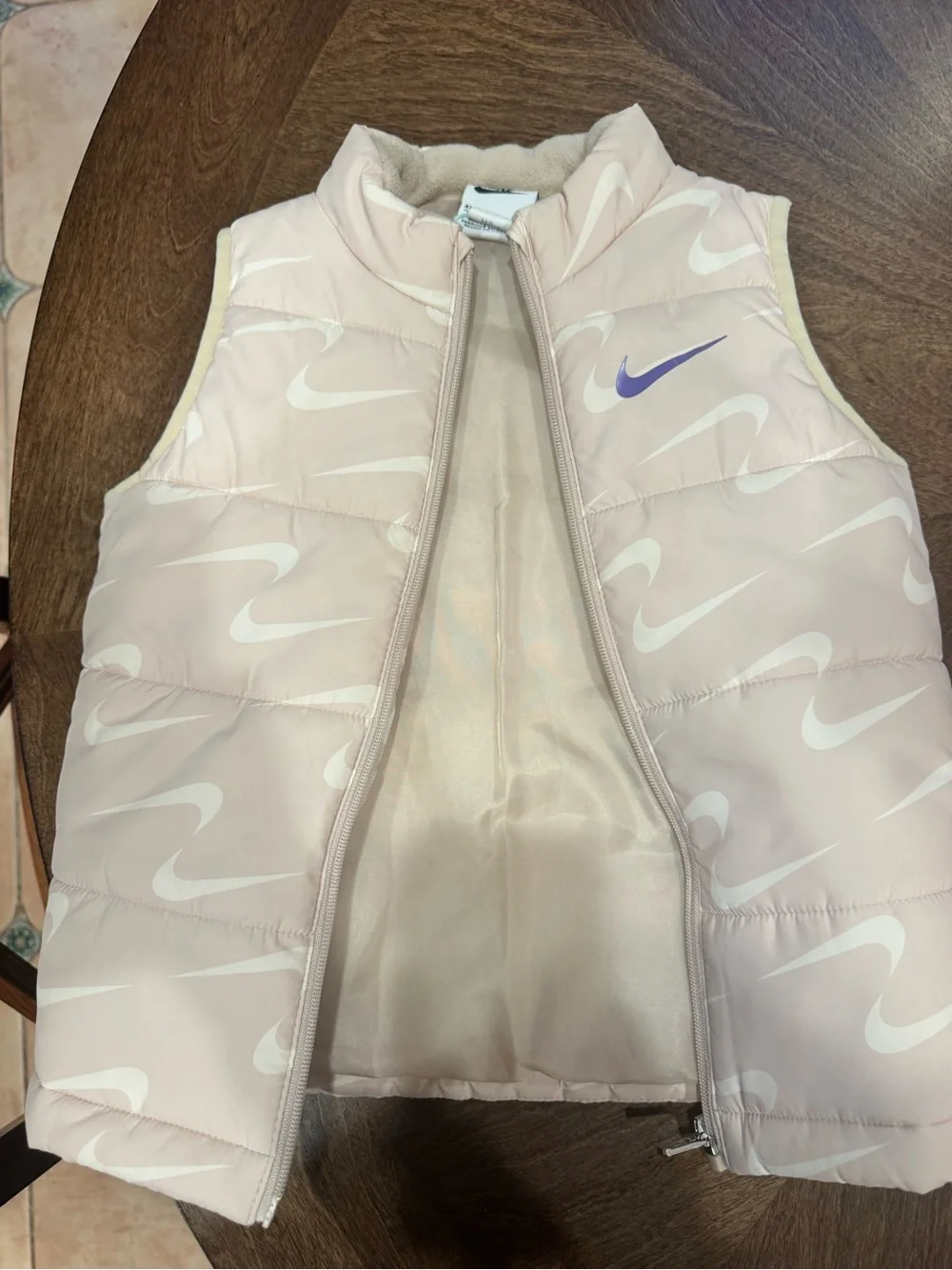 Nike Kids Light Pink Puffer Vest with White Swoosh Pattern